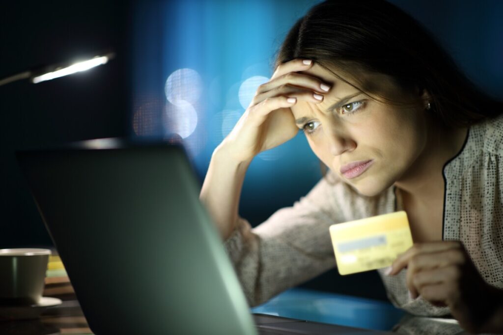 Worried,Woman,In,The,Night,Buying,Online,With,Credit,Card
